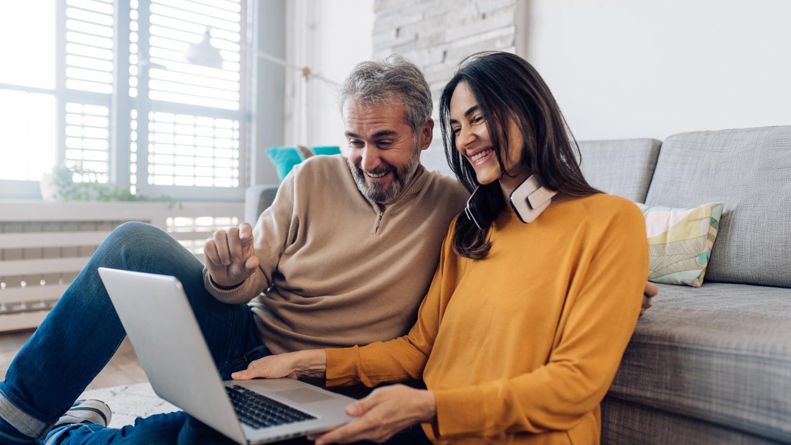 Family reviewing life insurance coverage documents at kitchen table
